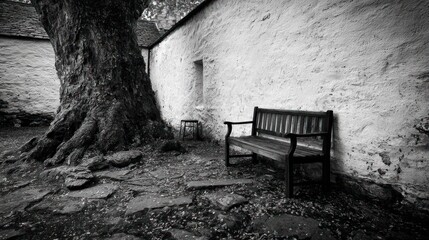 Old stone walls, a tree, and a bench