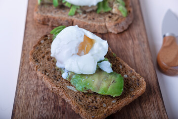 one avocado and egg benedict sandwich