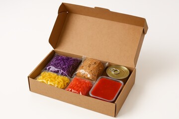 food items in cardboard box with canned goods, pasta, vegetables, and bread. concept of meal kit delivery, diverse ingredients, convenience, white background