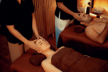 Couple customer enjoying relaxing anti-stress head massage and pampering facial beauty skin...