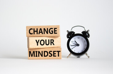 Change your mindset symbol. Concept words Change your mindset on wooden blocks with alarm clock....