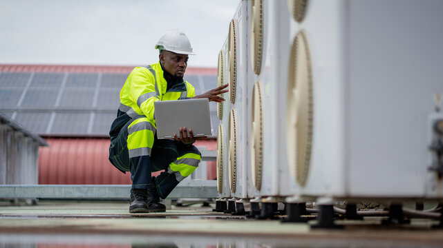 Engineers is checking the air conditioning cooling system of a major building or industrial facility. - Powered by Adobe
