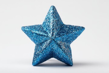Fototapeta premium Bright blue glittery star decoration standing upright against a neutral background, adding a festive touch to any celebration or display