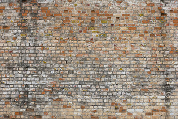 Weathered brick wall texture in urban outdoor setting
