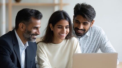 Fototapeta premium Professional indian teacher, executive or mentor helping latin student, new employee, teaching intern, explaining online job using laptop computer, talking, having teamwork discussion in office., no 