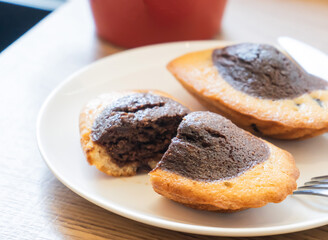 Marble Chocolate Madeleines in plate Gourmet French Cake with Rich Cocoa Swirl side view of dessert