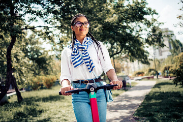 Young woman enjoying outdoor leisure on a sunny day during springtime in the city park on an...