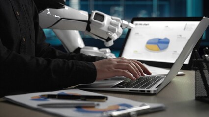 A modern workspace showcasing a human interacting with a laptop while a robot assistant displays...