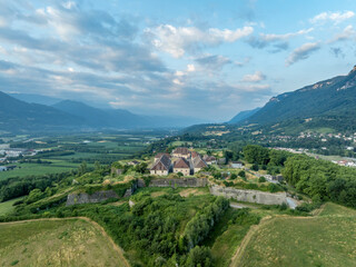 Fototapeta premium Aerial view of Fort Barraux above the Isere valley in France, star shaped fortress with bastions, demi lunes, casamate, lunettes, commanding the road below