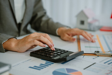 Close-up shot of a real estate agent or realtor meeting with her client, giving new house to her...