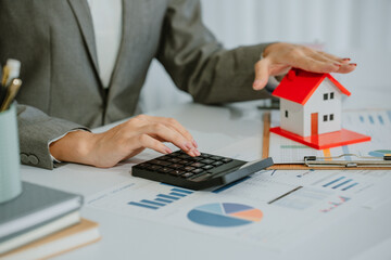 Close-up shot of a real estate agent or realtor meeting with her client, giving new house to her...