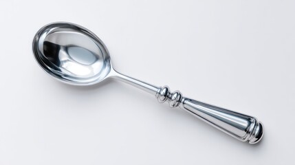 Polished silver spoon on a white background