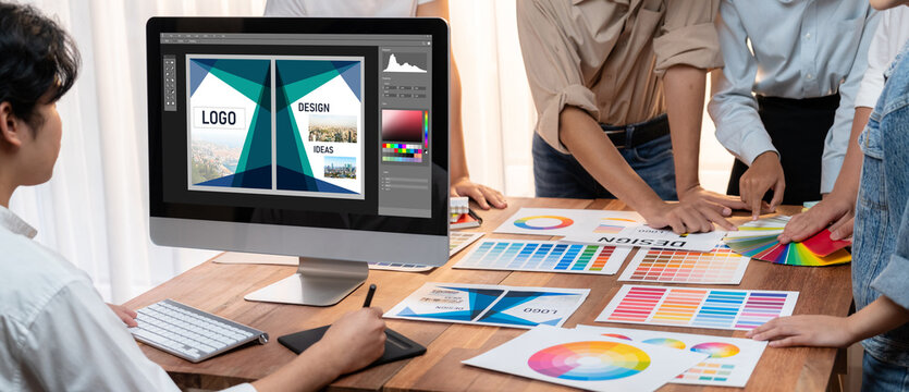 Graphic designer software for modern design of web page and commercial brisk ads showing on the computer screen