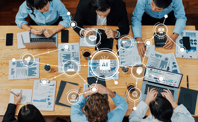A diverse group of professionals is engaged in a collaborative meeting focused on data analysis and...