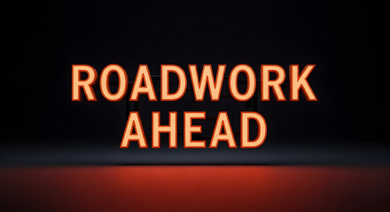 Obraz premium Warning Roadwork Ahead Sign Illuminating a Construction Zone on Dark Background