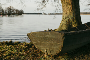 A old row boat near river © niklas storm