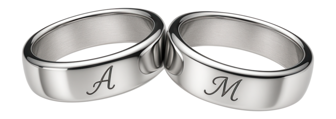 Sterling silver couple rings with engraved initials and a sleek finish