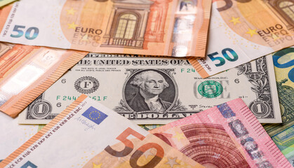Paper money, euro and dollar bills, exchange rate fluctuations. Paper cash euros and dollars as a financial background