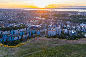 Aerial image of a beautiful sunset over the cityscape of Edinburgh from Salisbury Crags of Holyrood...