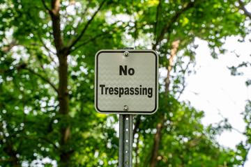 View of no trespassing sign in park.