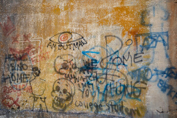 Old wall covered with graffiti
