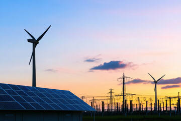 Solar Panels, Wind Turbines, and Power Lines at Sunset,  Modern Renewable Energy Generation Concept
