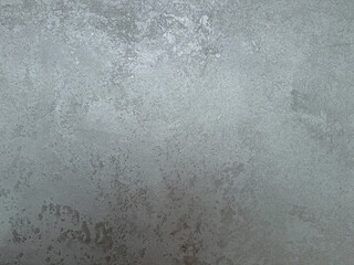 Decorative silver venetian plaster wall background, smooth metallic texture with soft shine, seamless luxury stucco surface for architecture, art and highend interior design.