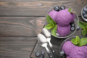 Tasty sorbet with blueberries and mint in dessert bowls on wooden table, flat lay. Space for text