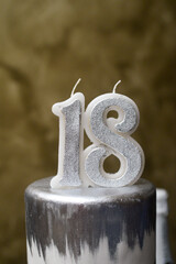 January 28, 2023 - Belgrade, Serbia. A three-tier birthday cake with silver decorations and the famous Chardonnay Brut Dargent. Cutting the cake and opening the champagne.