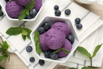 Tasty sorbet with blueberries and mint on wooden table, flat lay