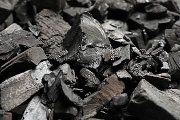 Pieces of black coals as background, closeup