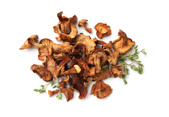 Dried chanterelle mushrooms and thyme isolated on white, top view
