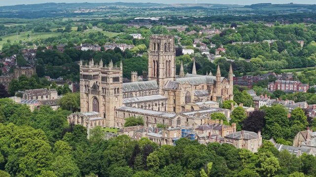 Aerial approach movement towards Durham Cathedral on a Summers day, England