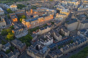 Aerial image of Edinburgh cityscape featuring Medieval Architectural buildings at Sunrise. 