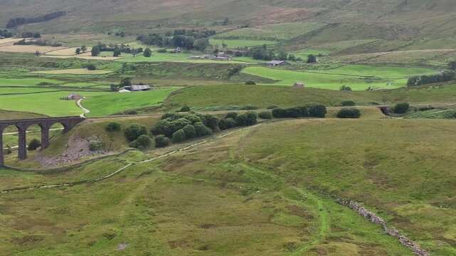Aerial Video of Ribblehead Viaduct. Viaduct carries the Settle&ndash;Carlisle railway across Batty Moss in the Ribble Valley at Ribblehead, in North Yorkshire, England