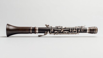 Dark wooden oboe on a plain background