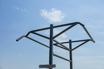 Two parallel horizontal bars stand in an outdoor gym, inviting fitness enthusiasts to engage in strength training activities in the fresh air