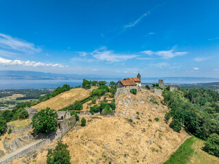 Aerial view of Allinges castle a medieval ruin and a castle with bastions on the hill above the Lake Geneva in France