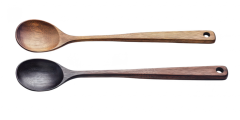 Two wooden spoons close up view on transparent png background