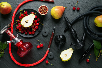 Hookah and fresh fruits on black table, flat lay