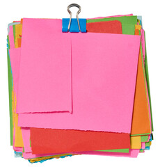 Stack of colorful square sticky notes with jagged edges, secured with a blue paper clip on top....