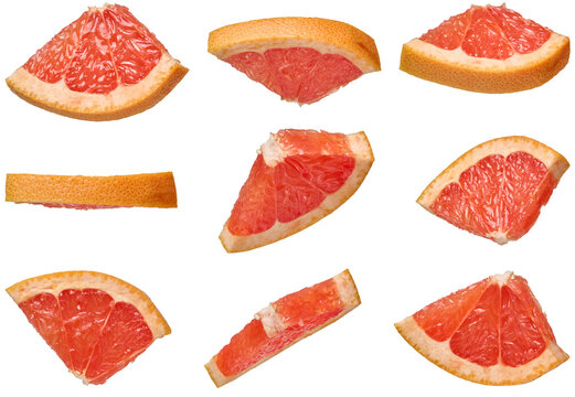 Triangular grapefruit slices with juicy pulp on an isolated background in different angles on an isolated background