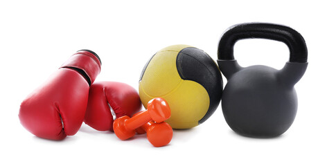 Medicine ball, kettlebell, dumbbells and boxing gloves isolated on white