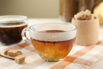 Aromatic instant coffee with sugar on light table, closeup