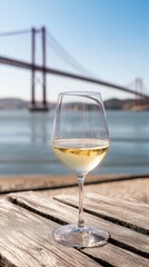 Obraz premium White wine and bridge view: Lisbon, Portugal winery ambiance captured in a single serene moment