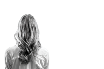 Young woman standing back view on white background