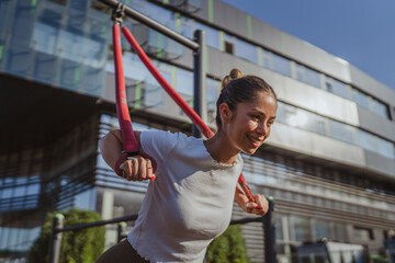 beautiful caucasian adult sports woman stretching at outdoor gym