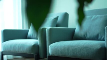 Green living room with cozy chairs and subtle plant decor
- Powered by Adobe