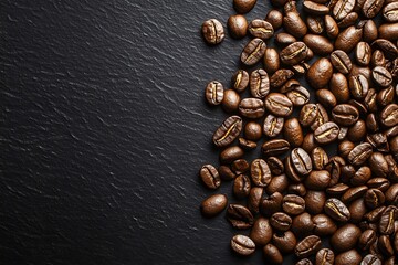 Dark roast coffee beans over black matte background