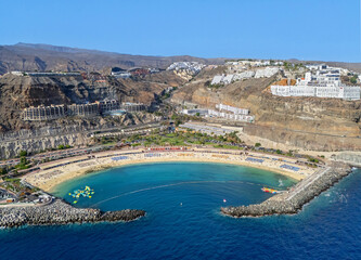 Hi Quality Aerial image of Playa De Amadores beach, Puerto Rico on the island of Gran Canaria, Canary Islands, Spain. 11th July 2025.